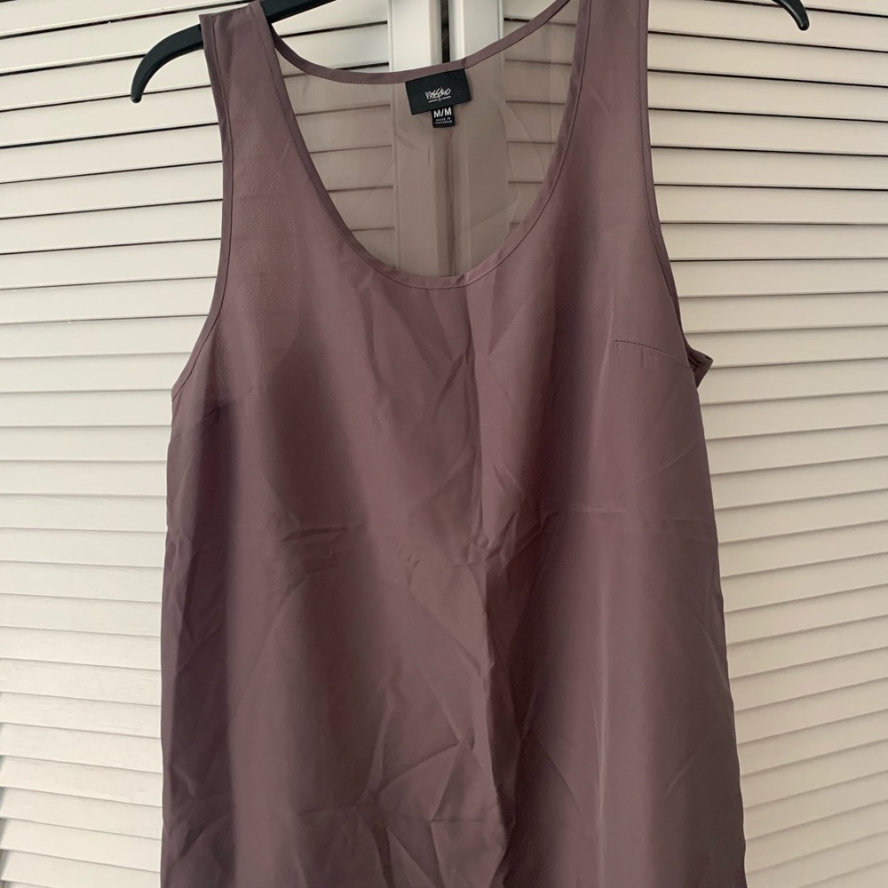 Tank with mesh back